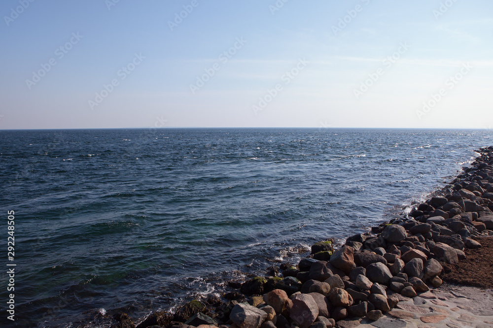 landscape with row of stones on the seaside