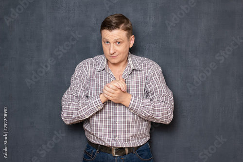 Portrait of motivated man rubbing hands being ready to act