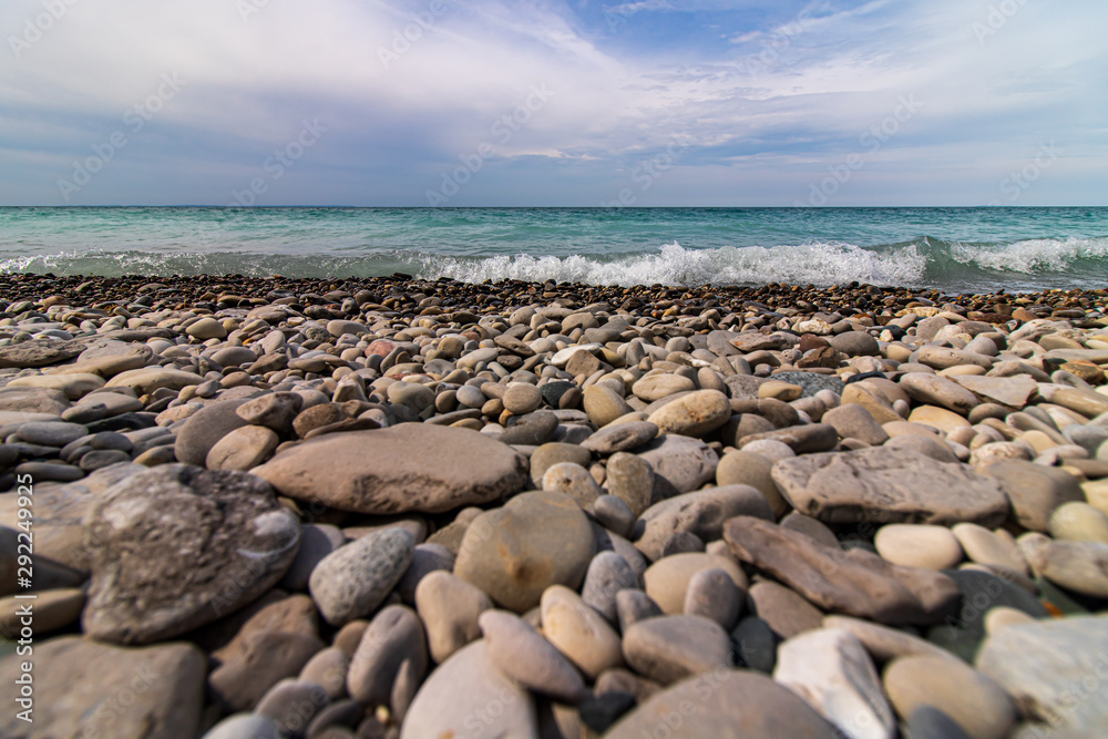 Low angle view of rocky beach and waves