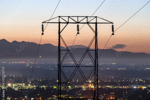 Predawn view of electric power lines entering the San Fernando Valley and Los Angeles, California.  The San Gabriel Mountains are in background.   photo