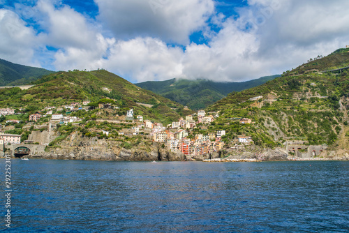 Obraz na płótnie Riomaggiore, Cinque Terre, Italy - August 17, 2019: Village by the sea bay, colorful houses on the rocky coast. Nature reserve resort popular in Europe w salonie