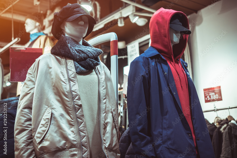 Fototapeta premium Clothes hipster winter fashion models in shopping center in boutique store. Fashionable for people young stylish that show in department store for shopping