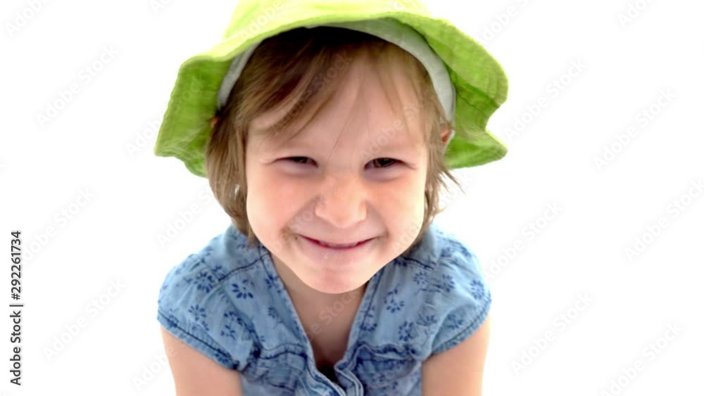 A happy little girl is waving her hand. A happy little girl is waving her hand.