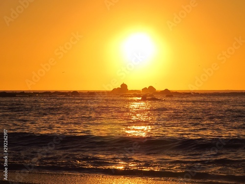 A beautiful sunset with the sun approaching the horizon at the sea seen from the beach of Algarrobo  Chili