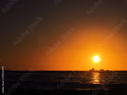 A beautiful sunset with the sun approaching the horizon at the sea seen from the beach of Algarrobo  Chili