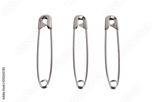 Safety pin brooch made from metal stainless  isolate on white