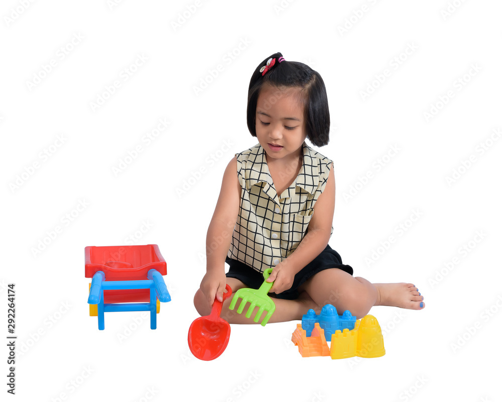 Cute Happy little child playing beach toys isolate on white Cute Happy little child playing beach toys isolate on white