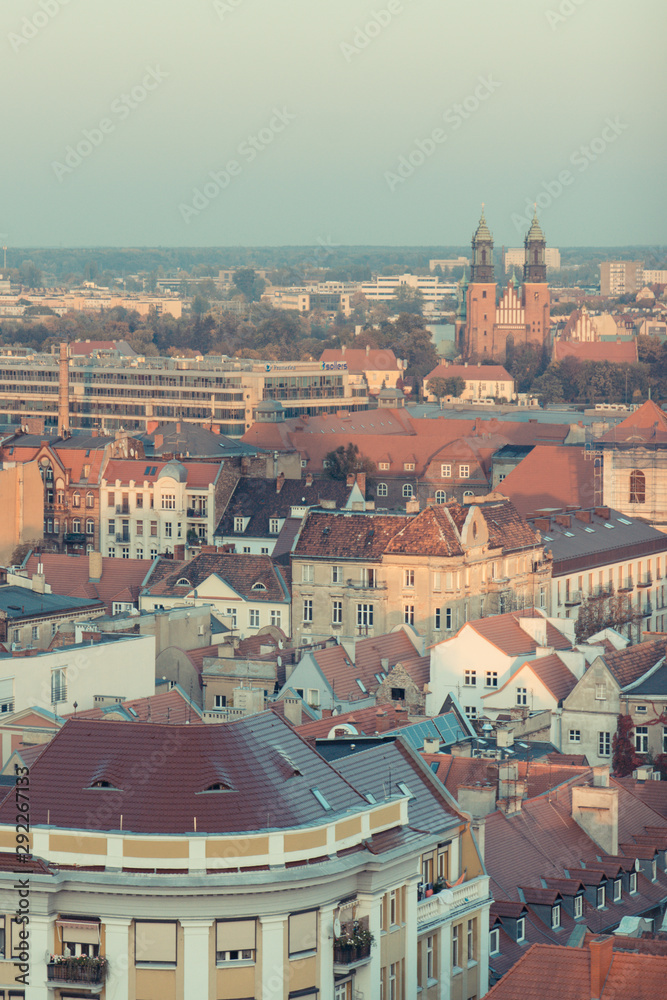 Poznan, Poland - October 12, 2018: View on old and modern buildings at sunset in town Poznan. Vintage photo