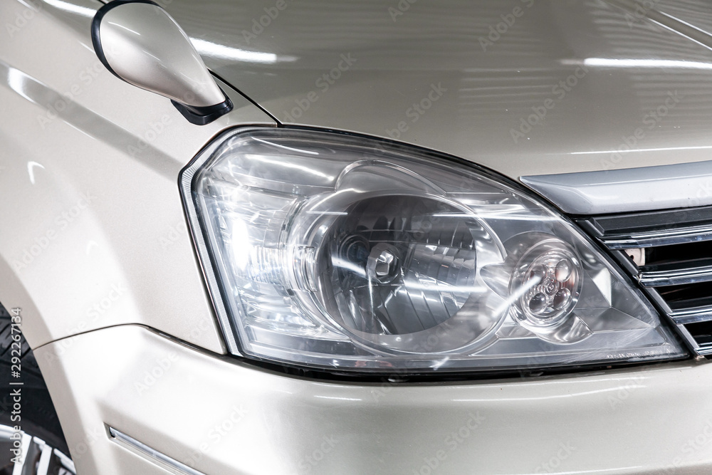 Close up of the car headlights. Exterior detail. Close up detail on one of the LED headlights modern car..