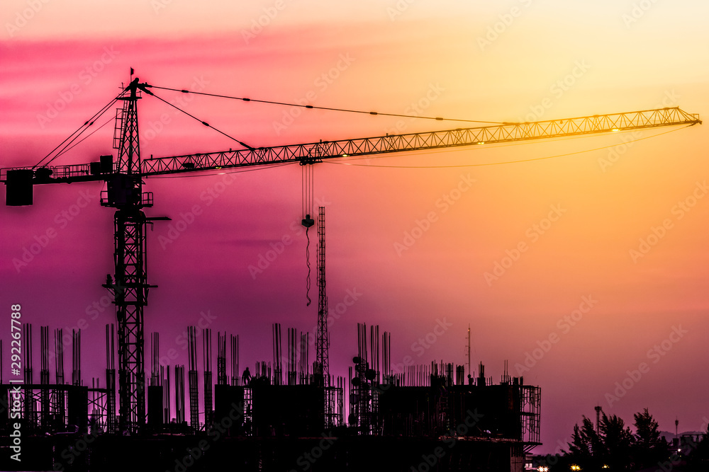 construction crane at sunset sky in the evening