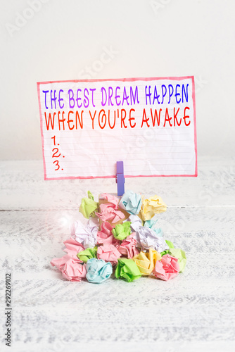 Conceptual hand writing showing The Best Dream Happen When You Re Awake. Concept meaning Dreams come true Have to believe Reminder pile colored crumpled paper clothespin wooden space