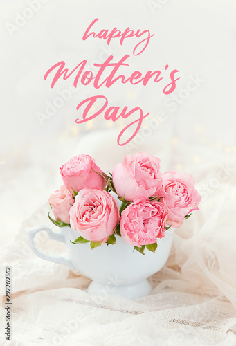 happy Mother’s Day. pink roses on white background. cute bouquet of roses in Cup. celebration concept of Mothers Day. beautiful scene of love and tenderness, greeting background. 