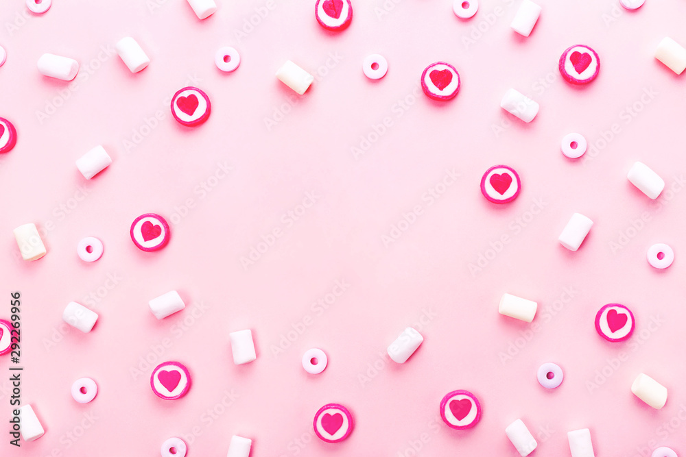 Delicious candies and marshmallows on pink background. Delicious candies and marshmallows on pink background.