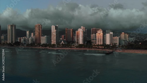 Wallpaper Mural Aerial drone footage of Honolulu, Hawaii. 
Beautiful real estate, buildings in the city. 
Palm trees, ocean and beach. Torontodigital.ca