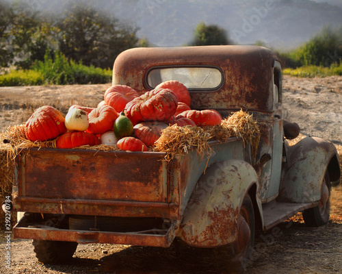 Old rusty truck full of fall pumpkins
