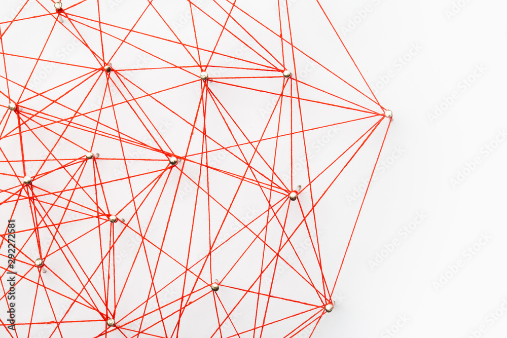 A large grid of pins connected with string. Communication, network concept A large grid of pins connected with string. Communication, network concept