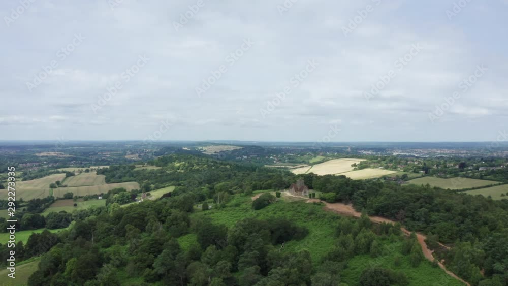 Aerial landscape of the English countryside, in the foreground there is a church surrounded by woodland. Aerial landscape of the English countryside, in the foreground there is a church surrounded by woodland.