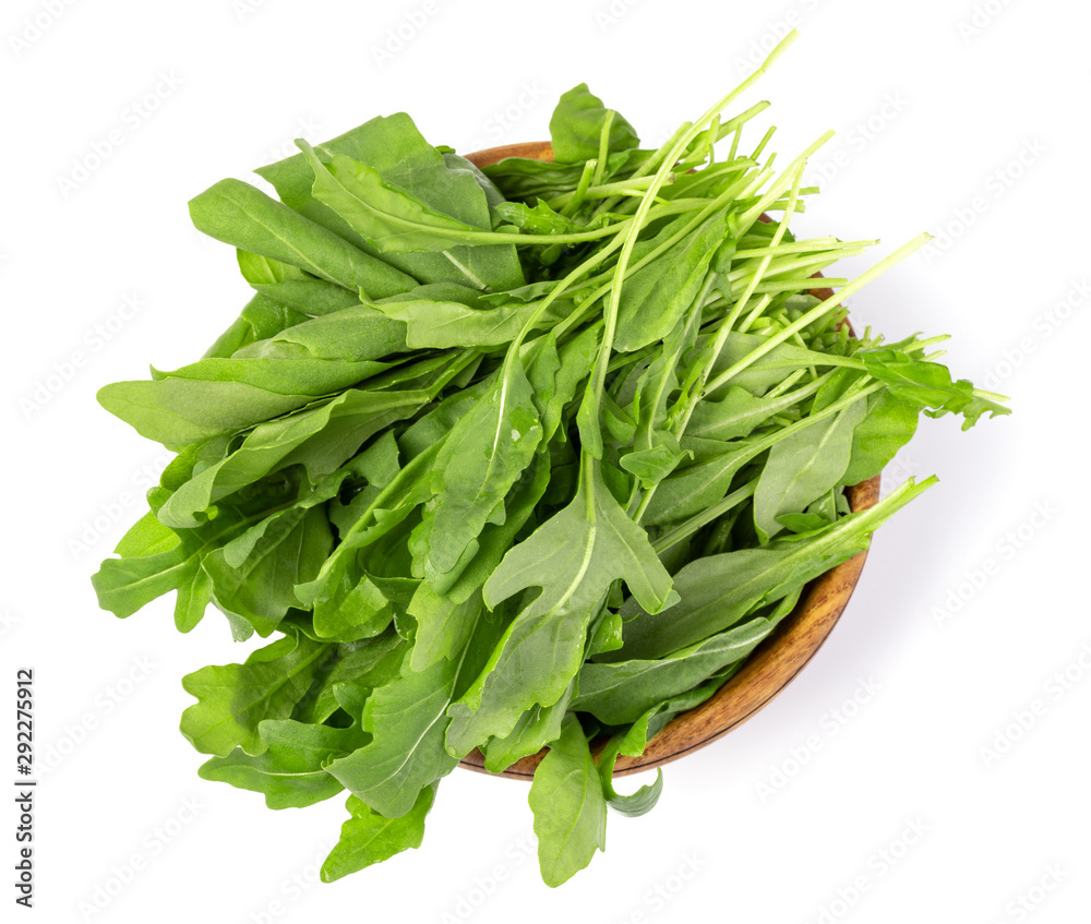 Fresh green arugula leaves on wooden bowl, Fresh green arugula leaves on wooden bowl,