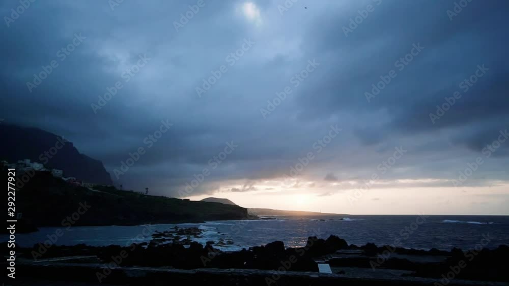 Stunning time lapse sunset by the ocean, cloudy day, Atlantic coast near the city of Garachico, Tenerife. Stunning time lapse sunset by the ocean, cloudy day, Atlantic coast near the city of Garachico, Tenerife.