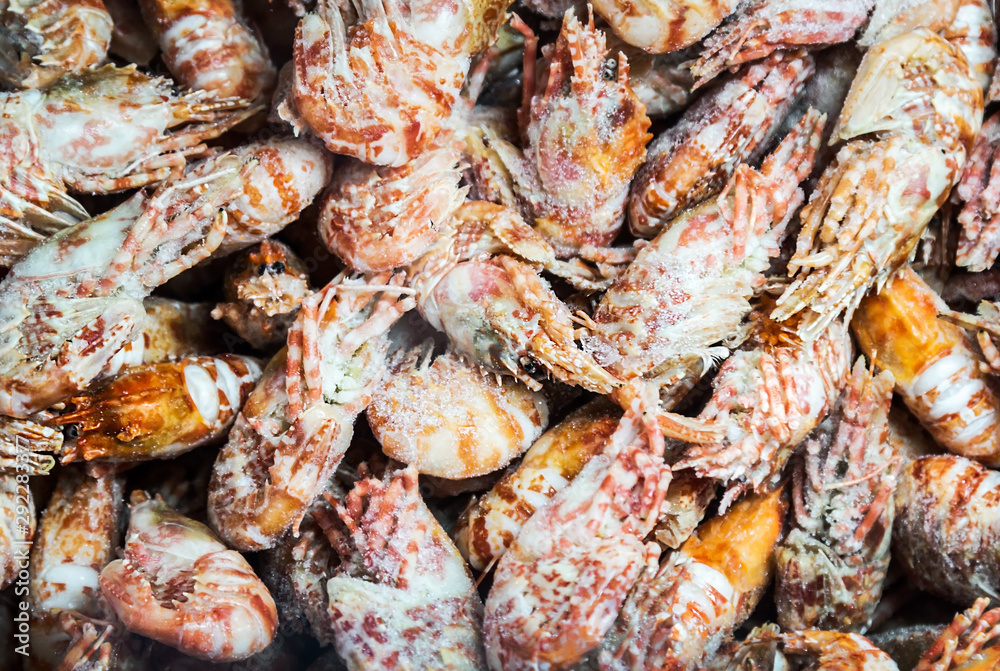 shrimp lie on the store or in the kitchen of a restaurant. Background seafood shrimp lie on the store or in the kitchen of a restaurant. Background seafood