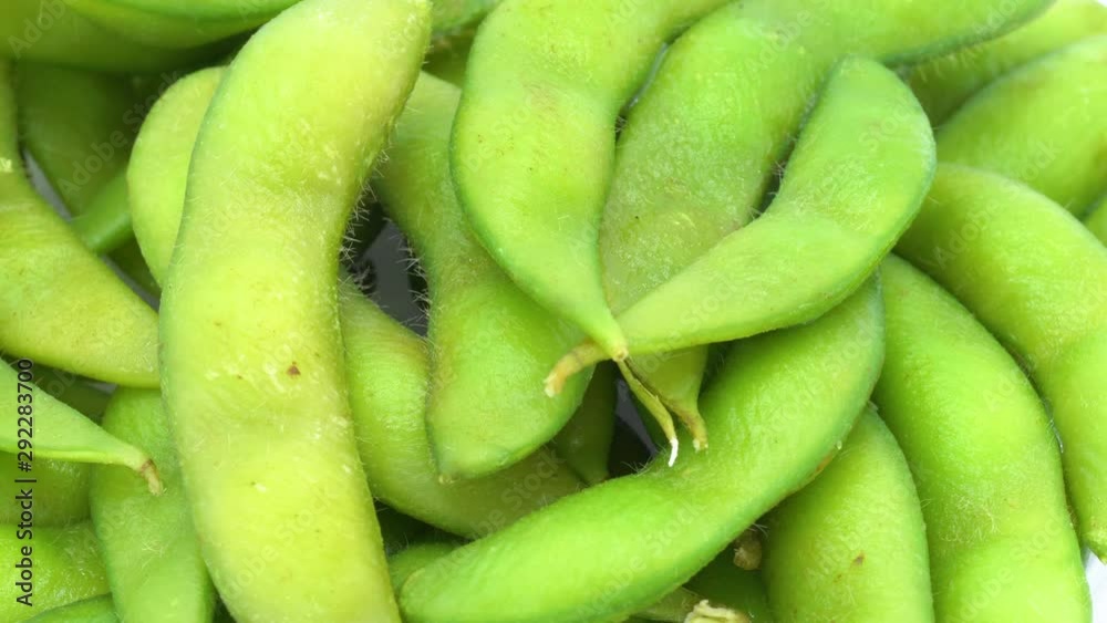 Edamame beans on white background with rotation, healthy food concept. Edamame beans on white background with rotation, healthy food concept.