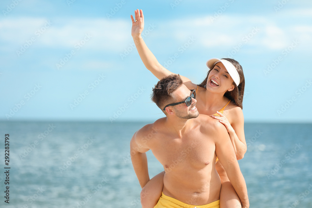 Portrait of happy couple at sea resort