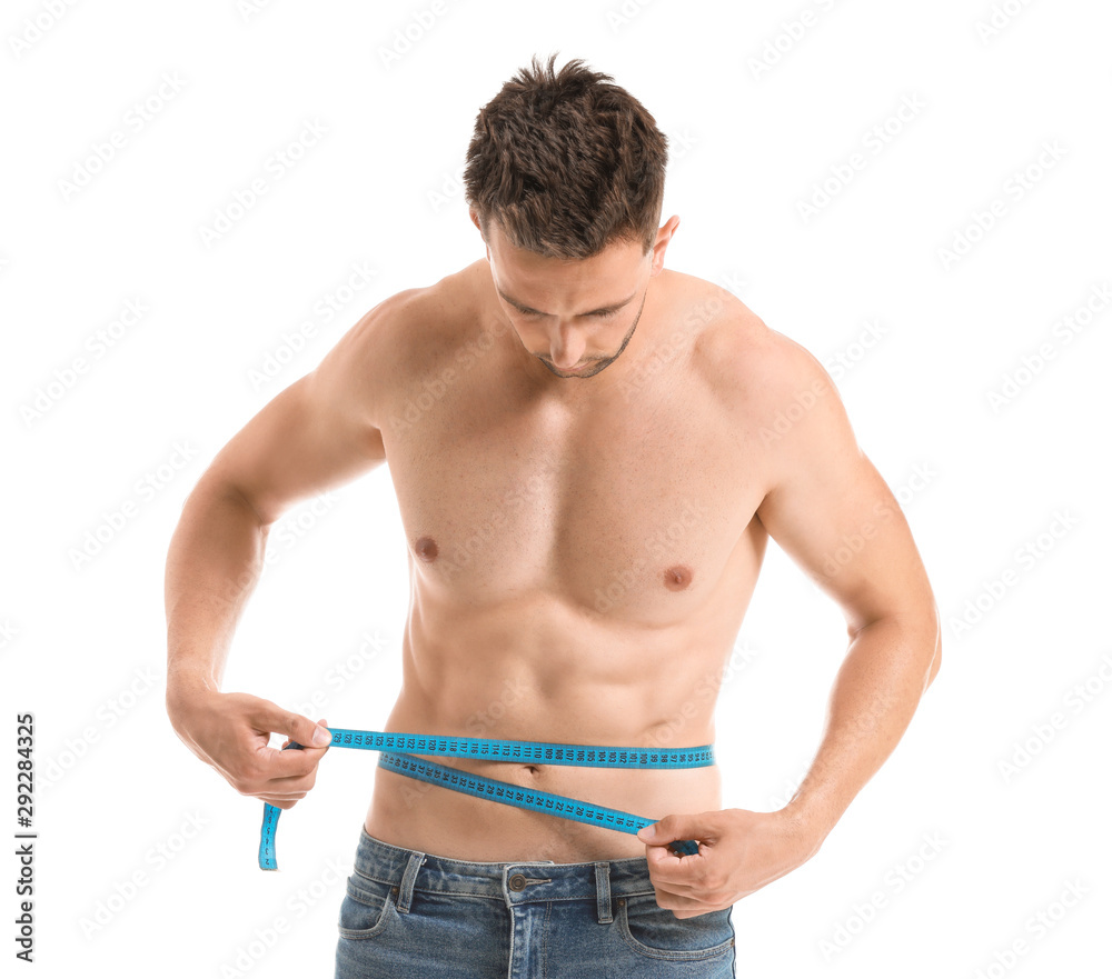 Handsome muscular man with measuring tape on white background. Weight loss concept Handsome muscular man with measuring tape on white background. Weight loss concept