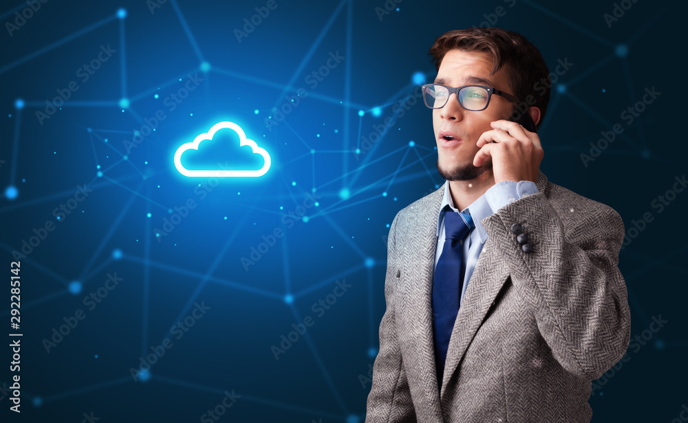 Person talking on the phone with blue cloud technology concept Person talking on the phone with blue cloud technology concept
