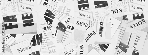Long horizontal banner with lots of old newspapers with Headlines and Articles. Background texture. Concept for news and information - could be used for web design or advertisement