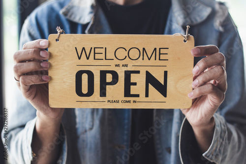 Close up sign hanging open Coffee shop door,Open sign blur background,Label word open