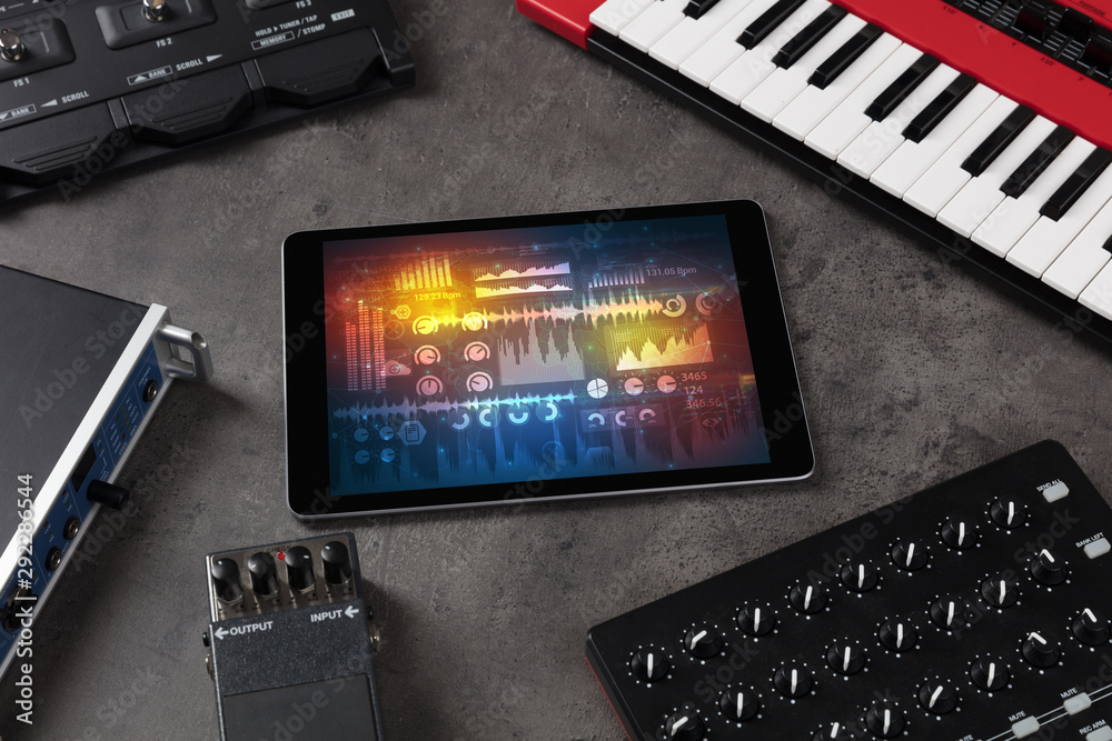 Electronic music instruments, microphone, piano, consoles and tablet with  reports concept Photos | Adobe Stock