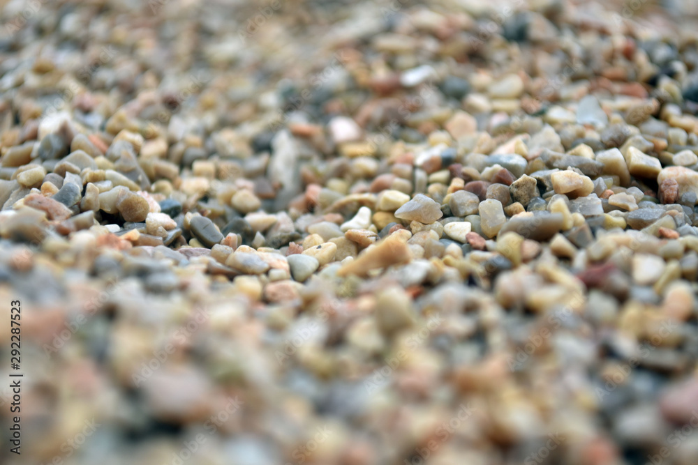 Sea pebble. Colorful small pebble and stone texture. Detailed sand texture.