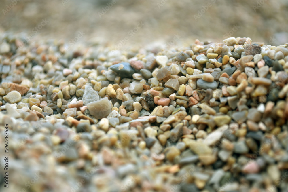 Sea pebble. Colorful small pebble and stone texture. Detailed sand texture. Sea pebble. Colorful small pebble and stone texture. Detailed sand texture.