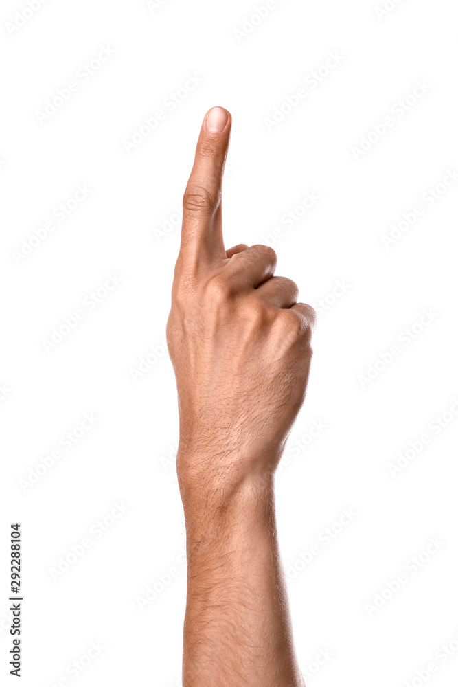Male hand with raised index finger on white background Male hand with raised index finger on white background