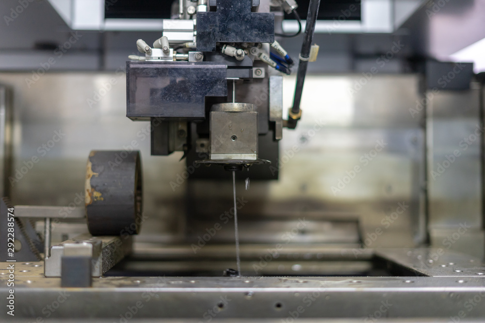 CNC wire cut machine cutting high precision mold parts CNC wire cut machine cutting high precision mold parts