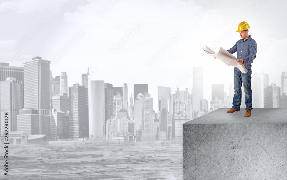 Young investor looking to the city from distance and thinking about investment Young investor looking to the city from distance and thinking about investment