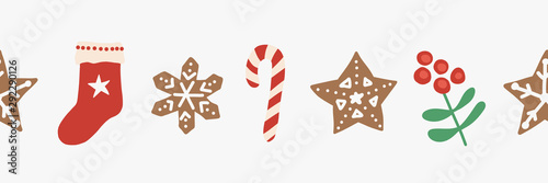 Christmas seamless vector border. Repeating Holiday design hand drawn. Gingerbread star cookie, candy cane, stocking, holly berry. For card decoration, ribbon, trim, party invitation, kids celebration