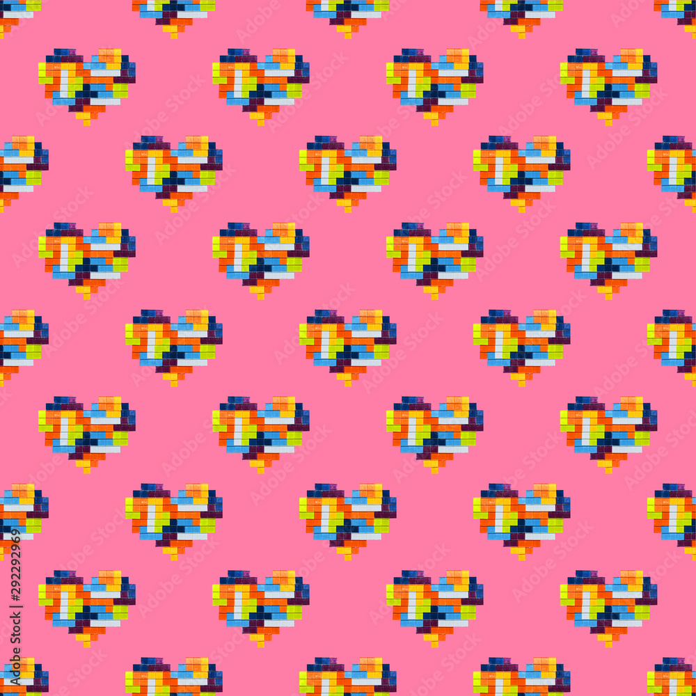 Multicolored mosaic hearts isolated on pink background, seamless pattern