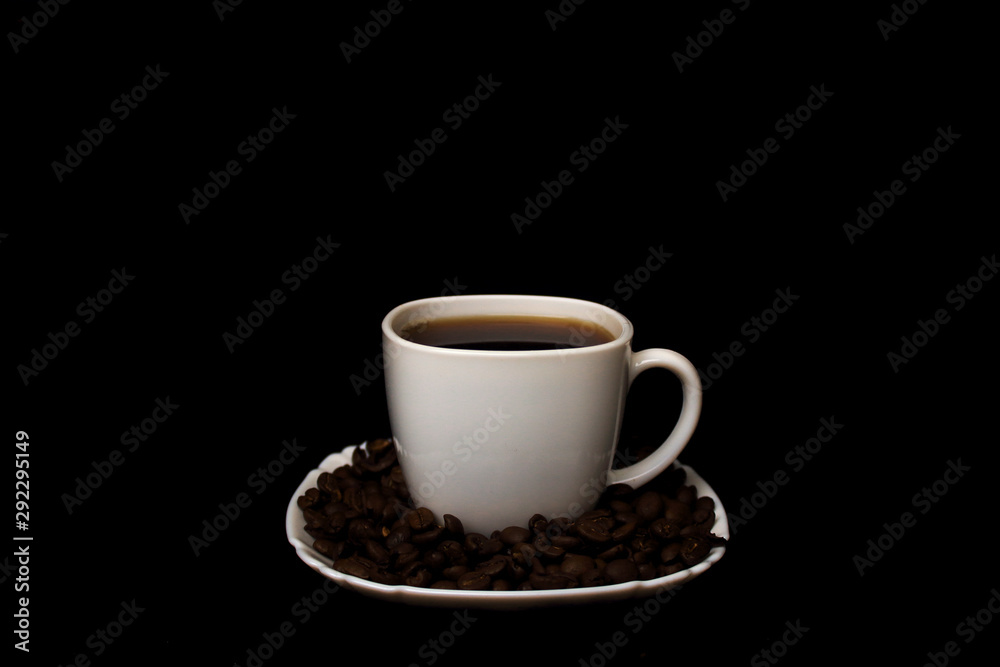 cup of coffee with coffee beans on black background cup of coffee with coffee beans on black background