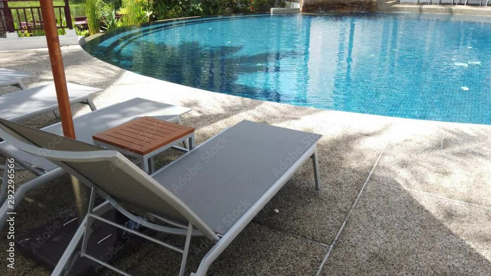 umbrella and chair around outdoor swimming pool in Luxury Hotel Resort Near sea and beach umbrella and chair around outdoor swimming pool in Luxury Hotel Resort Near sea and beach