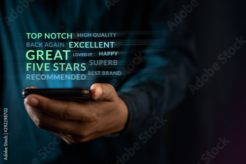 Customer Experiences Concept. Modern Man Reading Positive Review Rating via Smartphone. Client's Satisfaction Surveys on Mobile Phone. Front View