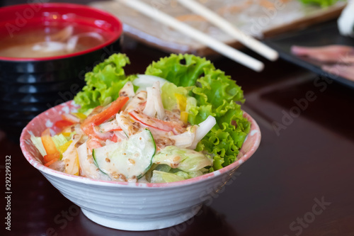 Fresh vegetable salad with crab stick in japanese restaurant, japanese food.