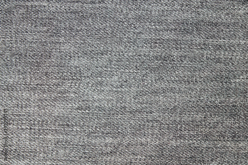 Close up of Classic dark grey jean texture background . Selective focus.