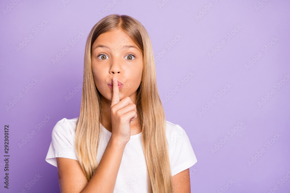 Close up photo of cute amazed shocked kid put index finger near lips say keep secret it is confidential news dont share wear style lifestyle outfit isolated over purple violet color background Close up photo of cute amazed shocked kid put index finger near lips say keep secret it is confidential news dont share wear style lifestyle outfit isolated over purple violet color background