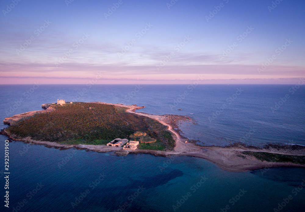 Wondeful aerial view at sunset of the island in front of Portopalo, a town in the south of Sicily. The shot is taken during a beautiful sunny day
