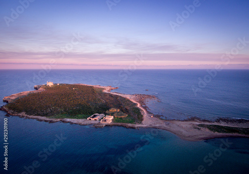 Wondeful aerial view at sunset of the island in front of Portopalo, a town in the south of Sicily. The shot is taken during a beautiful sunny day © gpiazzese