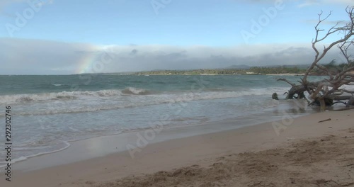 Rainbow and waves at the beach