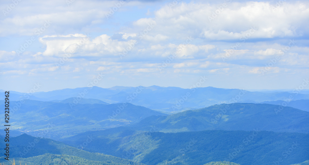 Obraz premium Landscape backdrop copy space. Scenery landscape hills with clouds. Travel and wanderlust concept. Landscape of mountains and valleys. Mountains covered with forest. Beautiful background