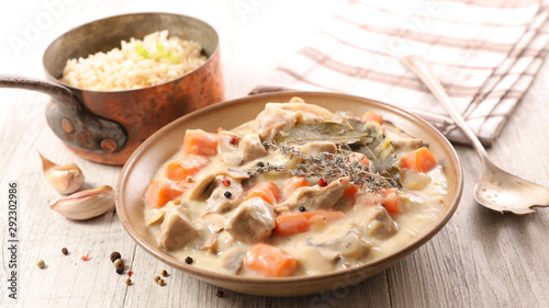 blanquette de veau, french gastronomy- veal cooked with cream,carrot and herbs photo