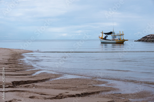Thai fishing boats parked on the shore after the fishermen had been searching for fish in the sea for several consecutive days.